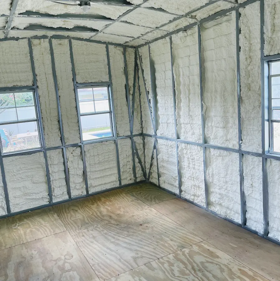 Closed-cell spray foam insulation applied to wall cavities in a residential project in Woodfin